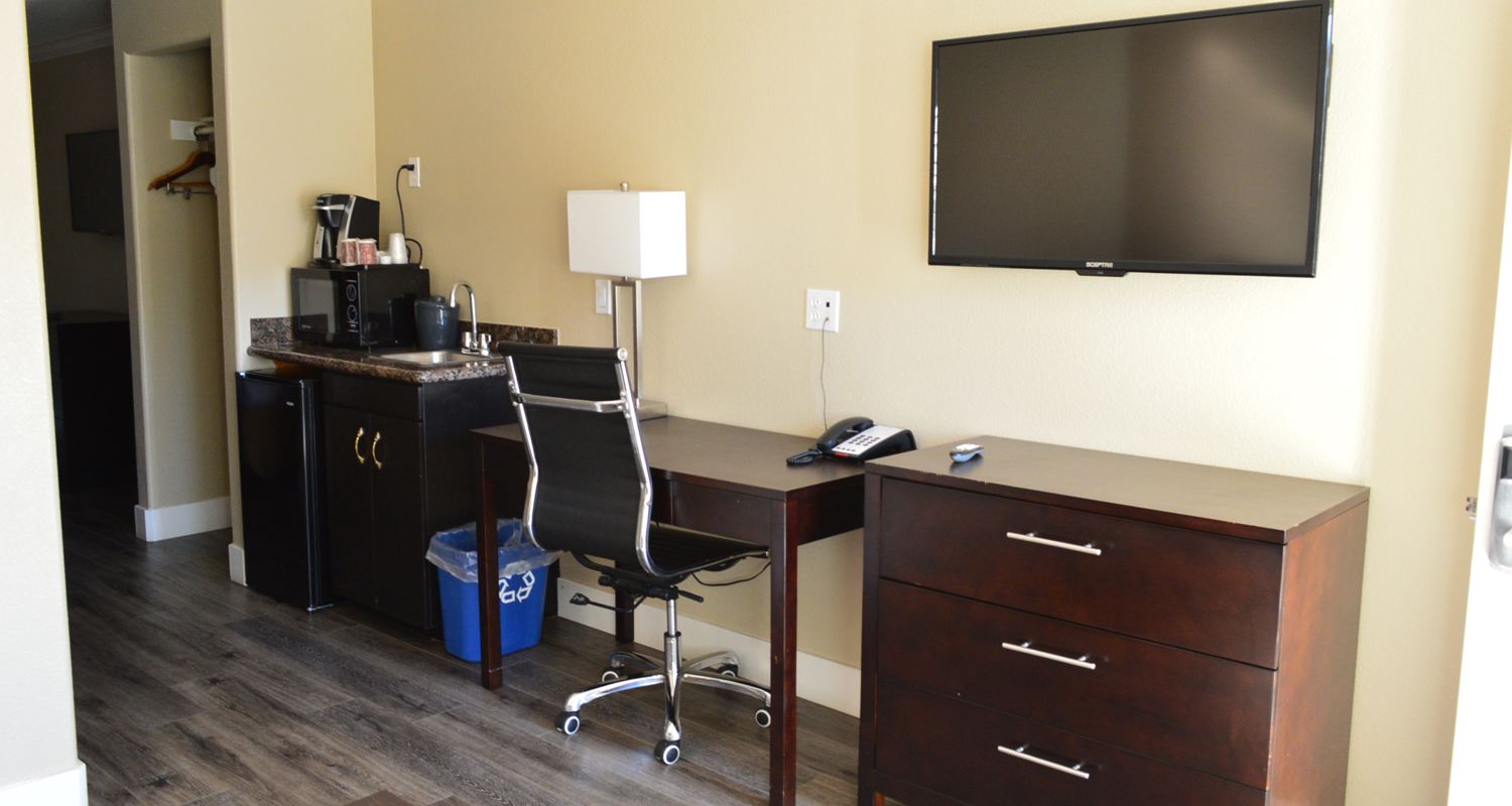 Fairview Inn & Suites Offers A Variety of In-Room Amenities, Including A Flat Screen TV & Work Desk with An Ergonomic Chair Fairview Inn & Suites Offers A Variety of In-Room Amenities, Including A Flat Screen TV & Work Desk with An Ergonomic Chair
